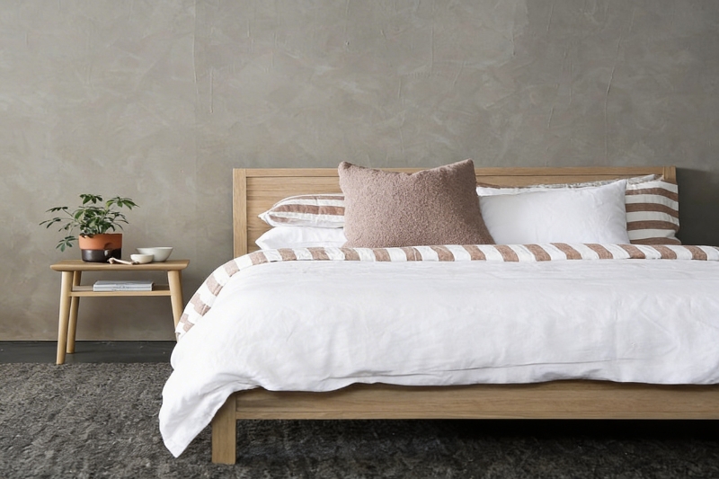 Stack of fluffy white hotel towels professionally laundered